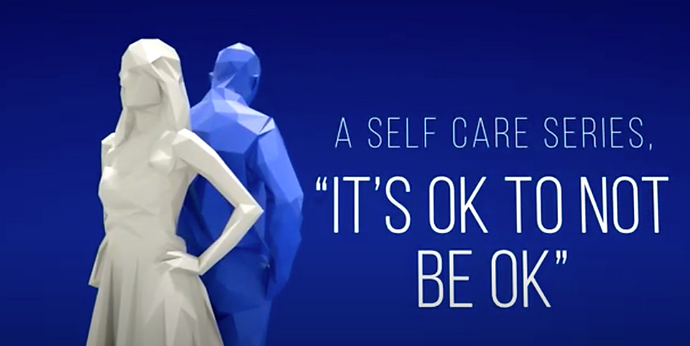 Stylized figures standing back-to-back with text reading 'It’s OK to Not Be OK' as part of a self-care series